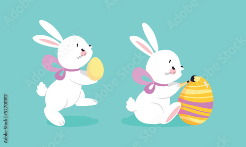 White Easter Bunny with Colorful Egg and Ribbon Bow on Blue Background Vector Set © topvectors
