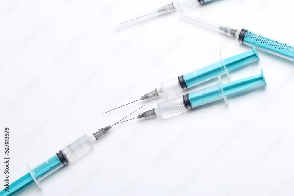 Medical syringe on a white background. A syringe for injection. The concept of health and beauty Medical syringe on a white background. A syringe for injection. The concept of health and beauty