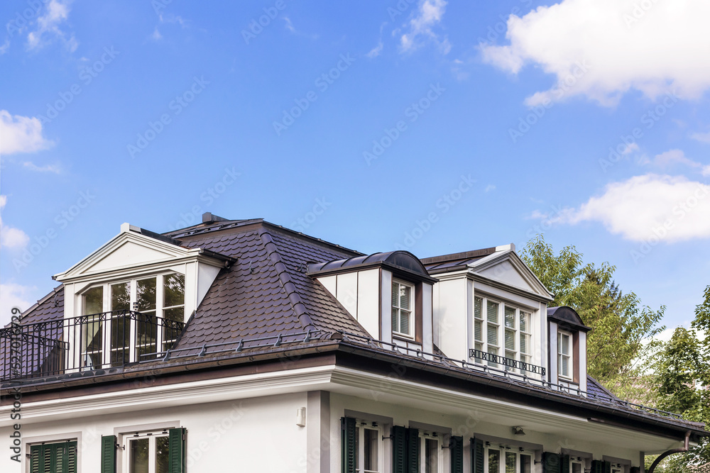 Dormer Windows, Skylight on Residential House, Roof tiles of cottage with dormer windows, drains, slopes, snow retainers. Garret of the house Dormer Windows, Skylight on Residential House, Roof tiles of cottage with dormer windows, drains, slopes, snow retainers. Garret of the house