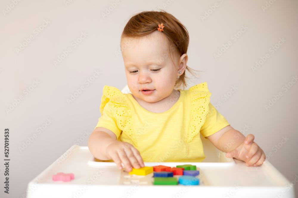 Emotional cute Baby is playing. Infant learning and development. Wooden eco-friendly educational toys. Montessori system. Emotional cute Baby is playing. Infant learning and development. Wooden eco-friendly educational toys. Montessori system.