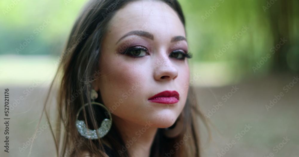 Portrait of pretty contemplative lonely sad young woman. Thoughtful pretty girl in outdoor park thinking Portrait of pretty contemplative lonely sad young woman. Thoughtful pretty girl in outdoor park thinking