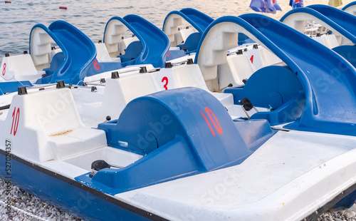 water catamarans on the beach of the resort town near the sea for tourists. Resort water transport. Boats for tourists.