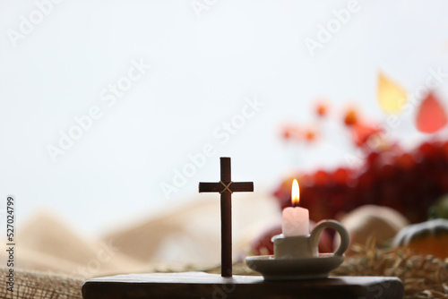 Church thanksgiving fruit decoration and background with candles and cross of Jesus 