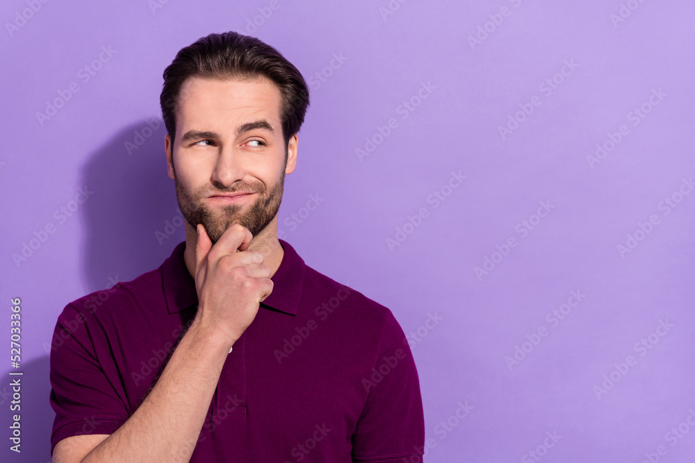Portrait of handsome attractive suspicious looking man brainstorming find solution to problem isolated on violet color background