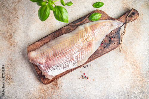 Photos raw saithe fish fillet without bones fresh dish healthy meal food snack diet on