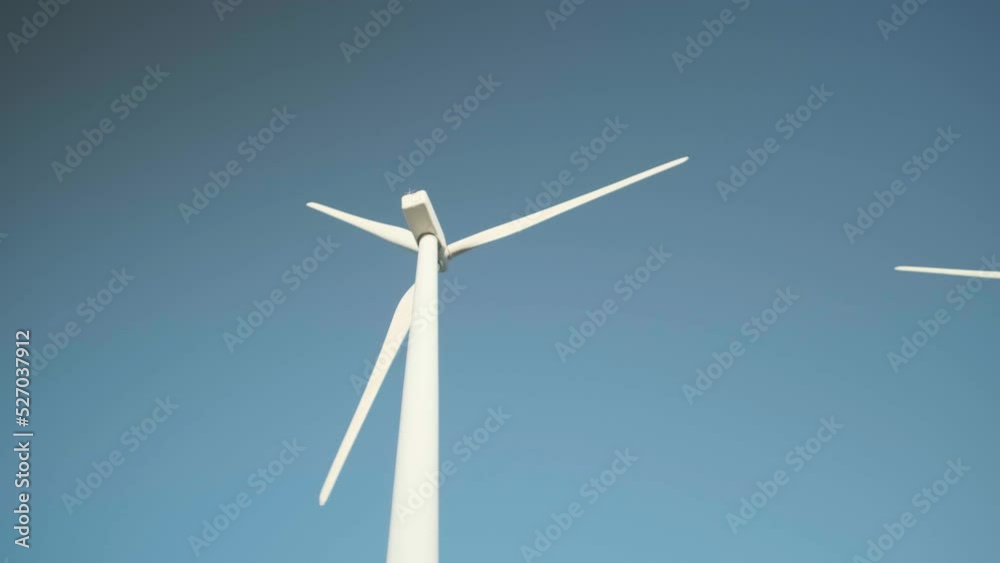 Close up view of a wind turbine with the propellers in motion. Close up view of a wind turbine with the propellers in motion.