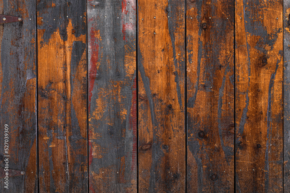 Rich spicy deep toned very textured reclaimed primitive wood planks like a fence with hinges on the edge and copy or ad space Rich spicy deep toned very textured reclaimed primitive wood planks like a fence with hinges on the edge and copy or ad space