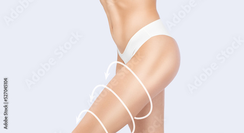 Young attractive woman with slim body in white lingerie. The concept of weight loss and healthy lifestyle.