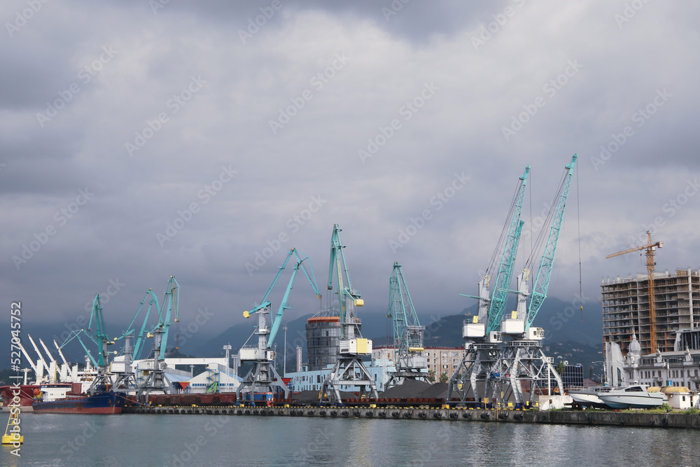 cargo cranes in the water area of the port of Batumi