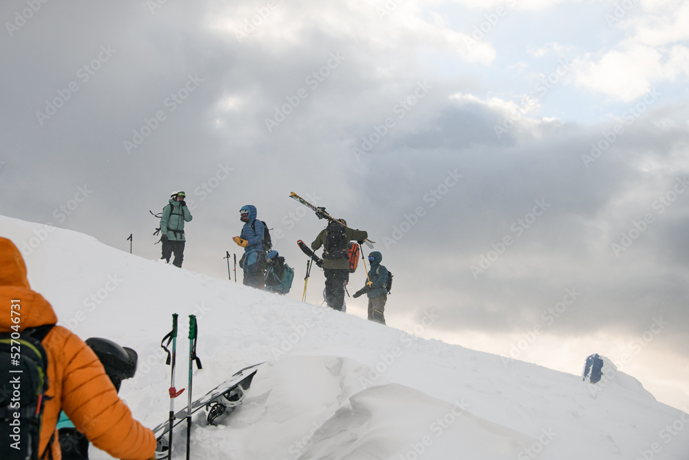 group of ski tourists with backpacks on winter snowy Carpathian mountains. Ski touring concept