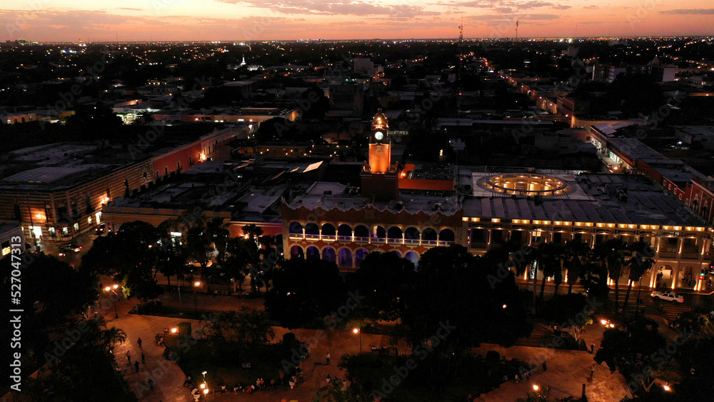 Aerial camera showing the Municipal Building at night with lights in Merida, Yucatan, Mexico.