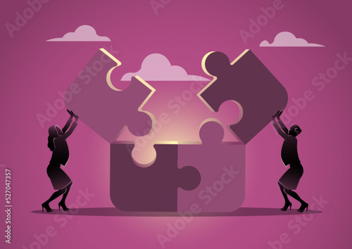 Businesswoman working together collecting puzzle