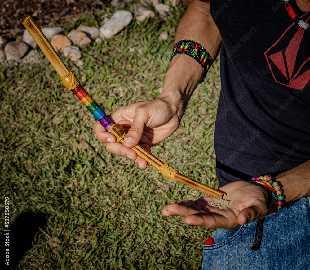 Εκτύπωση καμβά Sao Paulo, SP, Brazil - August 23 2021: Male hands holding tepi, instrument for application of indigenous snuff details