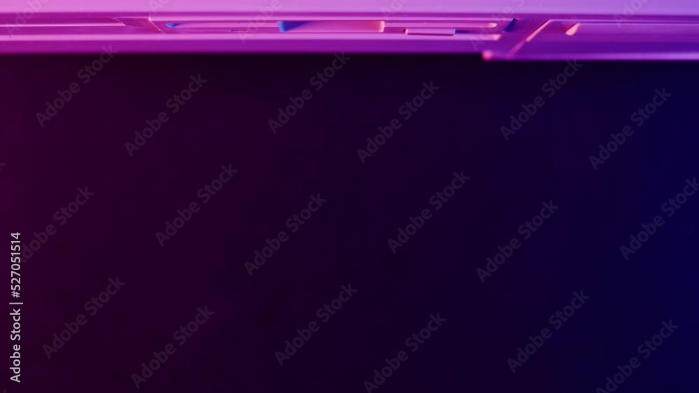 Using diskette with virus closeup. Old floppy disk, disc drive top view. Retro computer. Stock