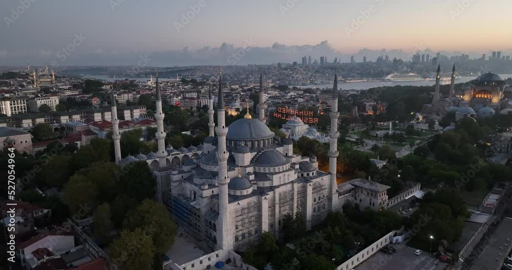 Istanbul, Turkey. Sultanahmet with the Blue Mosque and the Hagia Sophia with a Golden Horn on the background at sunrise. Cinematic Aerial view. Istanbul, Turkey. Sultanahmet with the Blue Mosque and the Hagia Sophia with a Golden Horn on the background at sunrise. Cinematic Aerial view.