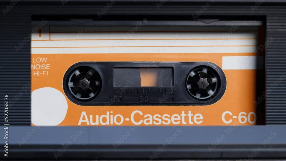 Retro radio tape recorder, audio cassette close-up. Listening to music, old radio boombox player, searching channel. 