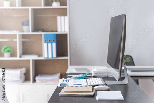 Stylish workspace with desktop computer and office supplies in business office.