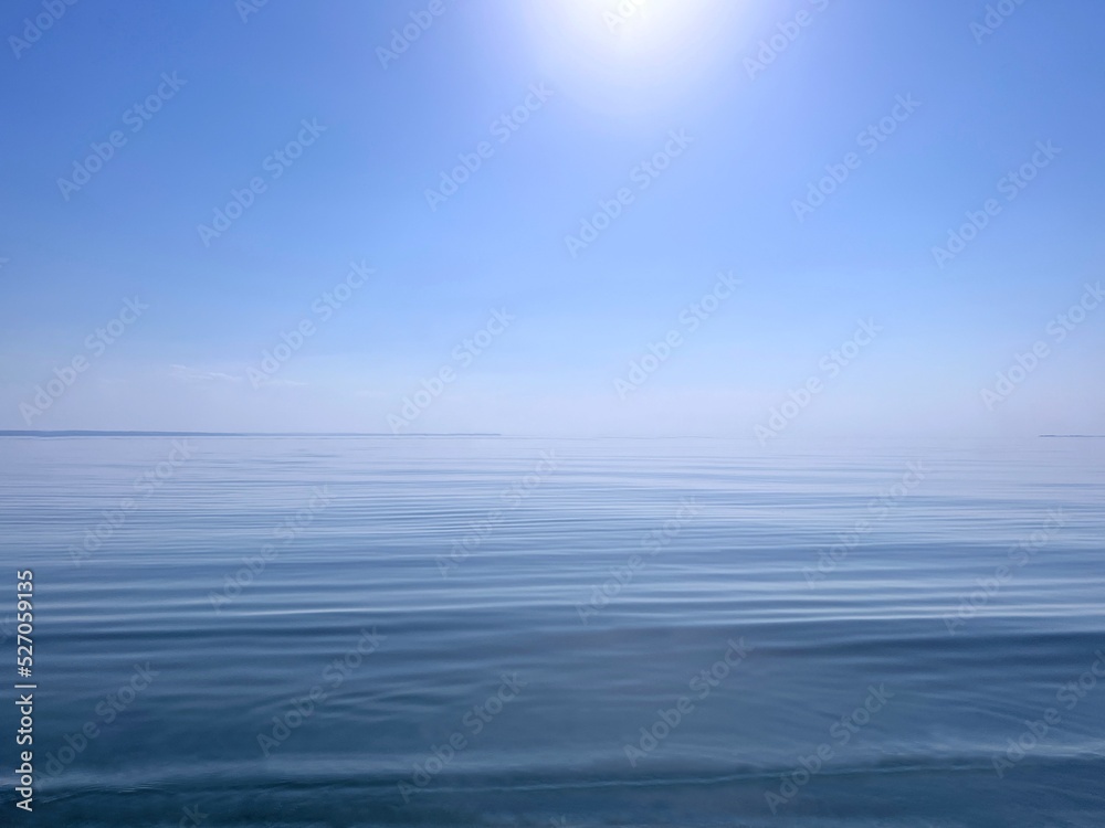 Blue sky and calm sea water at sunny day.