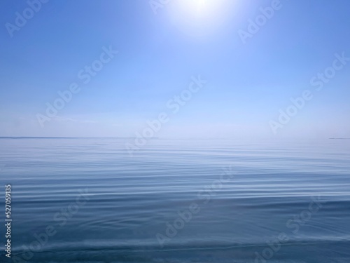 Blue sky and calm sea water at sunny day.