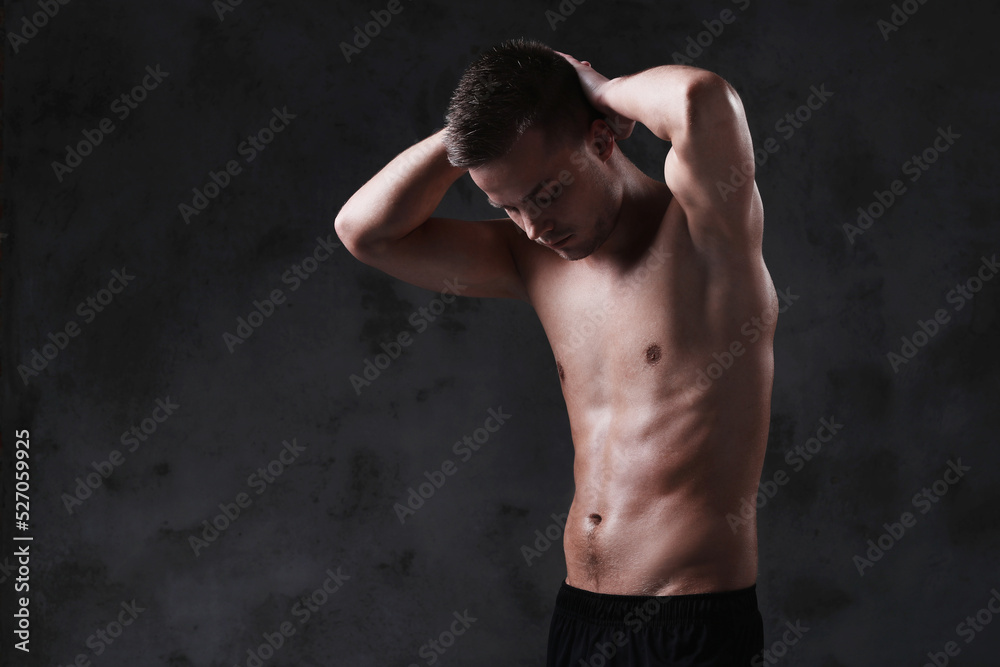 Sculpted to Perfection: Male Model Showcases His Fit Physique in a Studio Photoshoot