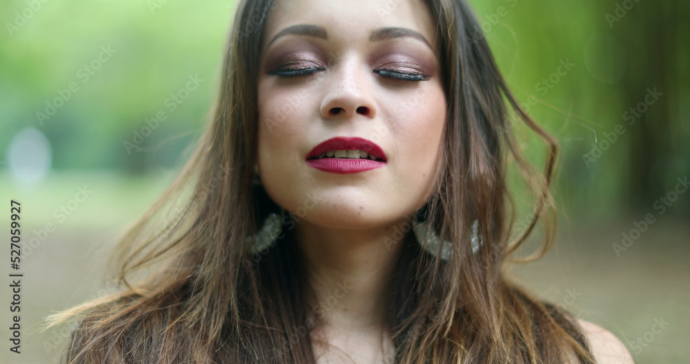 Pretty girl taking a breath of fresh air feeling relaxed Pretty girl taking a breath of fresh air feeling relaxed