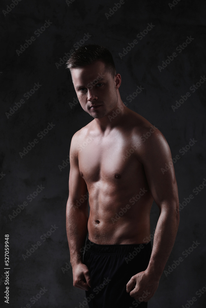 Sculpted to Perfection: Male Model Showcases His Fit Physique in a Studio Photoshoot