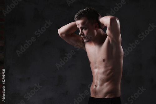 Sculpted to Perfection: Male Model Showcases His Fit Physique in a Studio Photoshoot