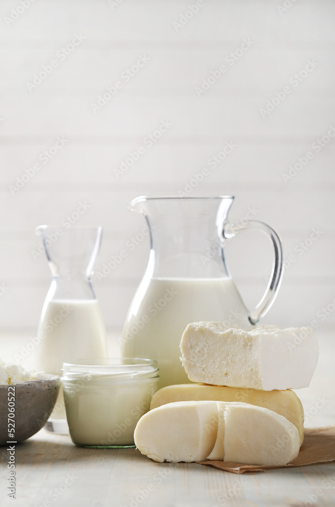 Homemade cooked healthy milk products for breakfast in a wooden bowl on the table and near a bottle of milk. Place for text. Fitness food, snack Homemade cooked healthy milk products for breakfast in a wooden bowl on the table and near a bottle of milk. Place for text. Fitness food, snack