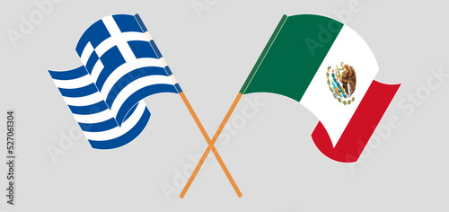Crossed and waving flags of Greece and Mexico