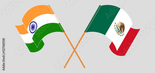 Crossed and waving flags of India and Mexico
