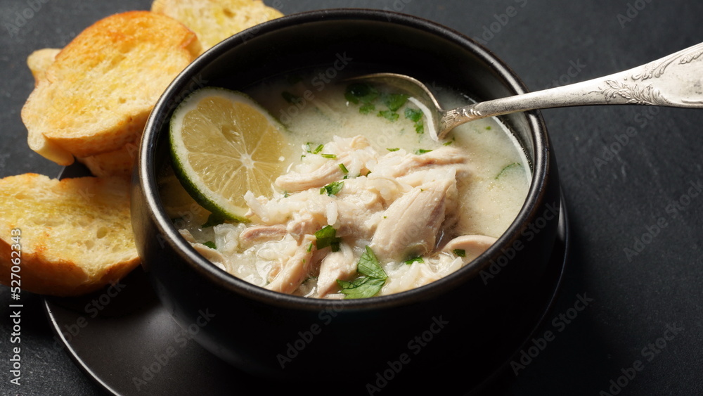 Avgolemono - traditional greek chicken soup with rice, lemon and eggs