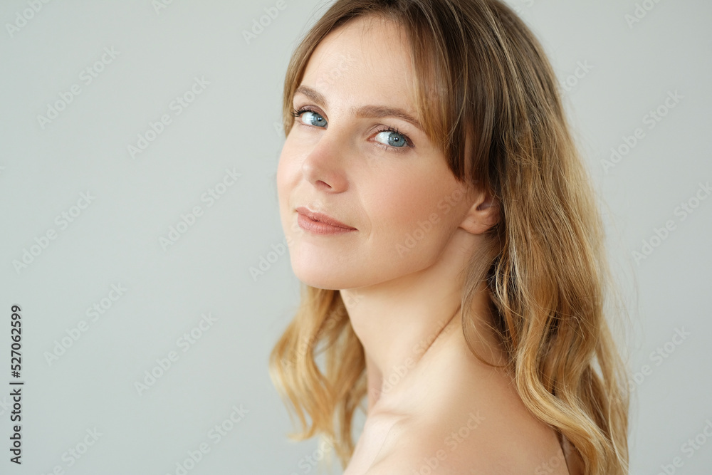 Close view of young blond woman looks at camera and pose at home Close view of young blond woman looks at camera and pose at home