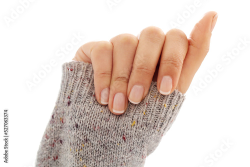 Beautiful women’s hands with groomed nails on a light background