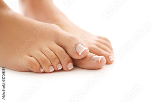Beautiful female pedicure on a white background