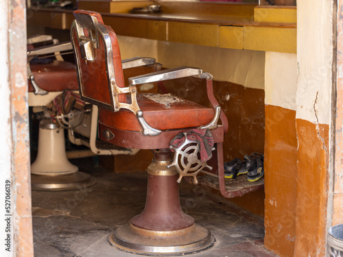 Old and rickety barber chair in Jaisalmer, Rajasthan (India) photo