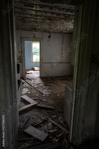A badly damaged abandoned house interior © Richard Nantais