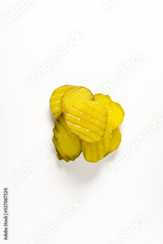 dill pickle chips in crinkle cut isolated on white background