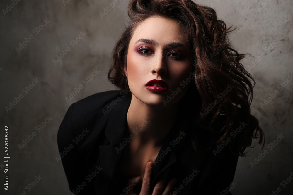 A photo of a young beautiful woman model in black posing for camera A photo of a young beautiful woman model in black posing for camera