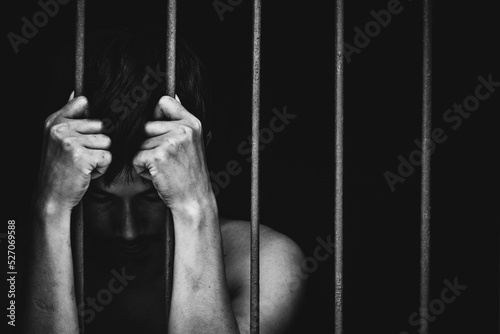 Fotobehang prison man crime in gaol, hold hand iron bar jail, punishment convict in justice