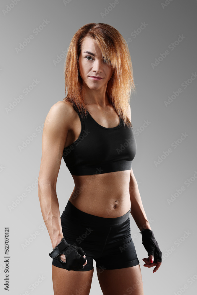 Sporty beautiful young woman posing on camera Sporty beautiful young woman posing on camera