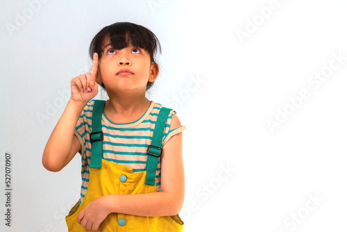Cute little girl thinking on white background