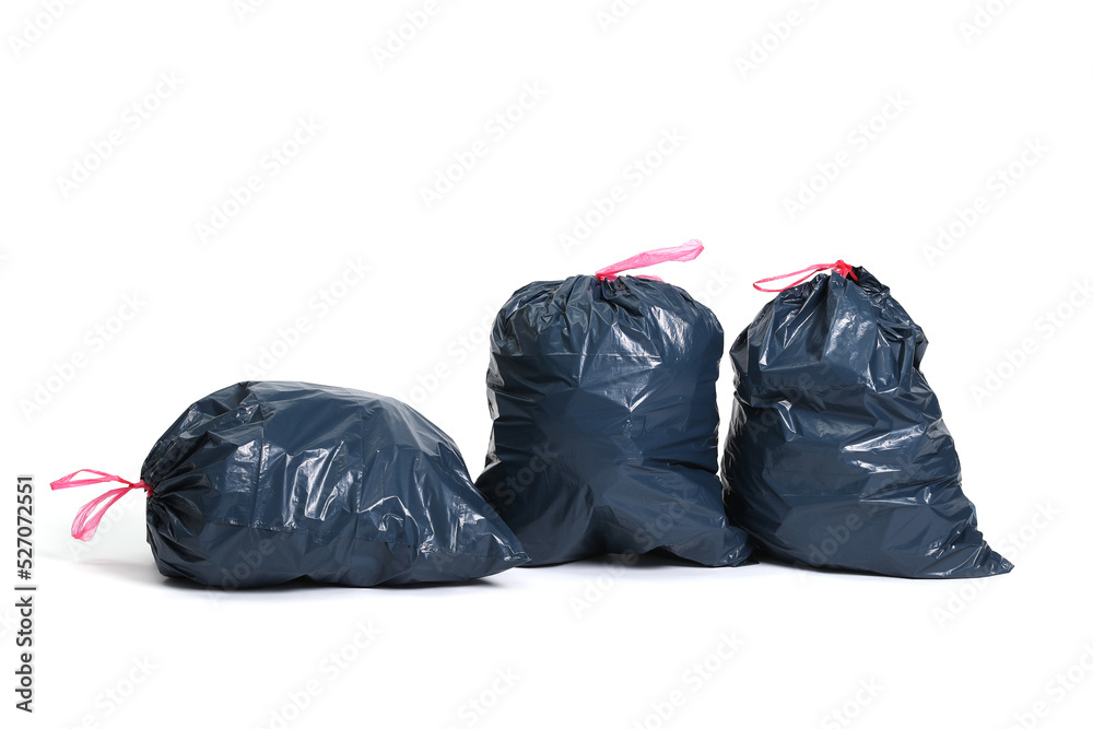 Three big black plastic bags for trash waste placed on a white background Three big black plastic bags for trash waste placed on a white background