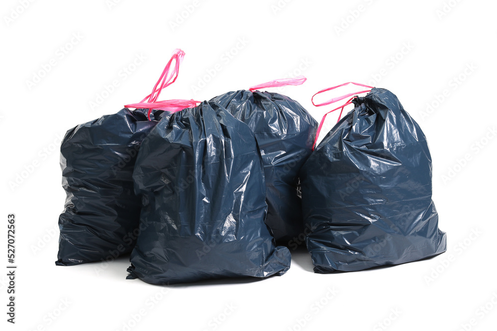 Many big black plastic bags for trash waste placed on a white background Many big black plastic bags for trash waste placed on a white background