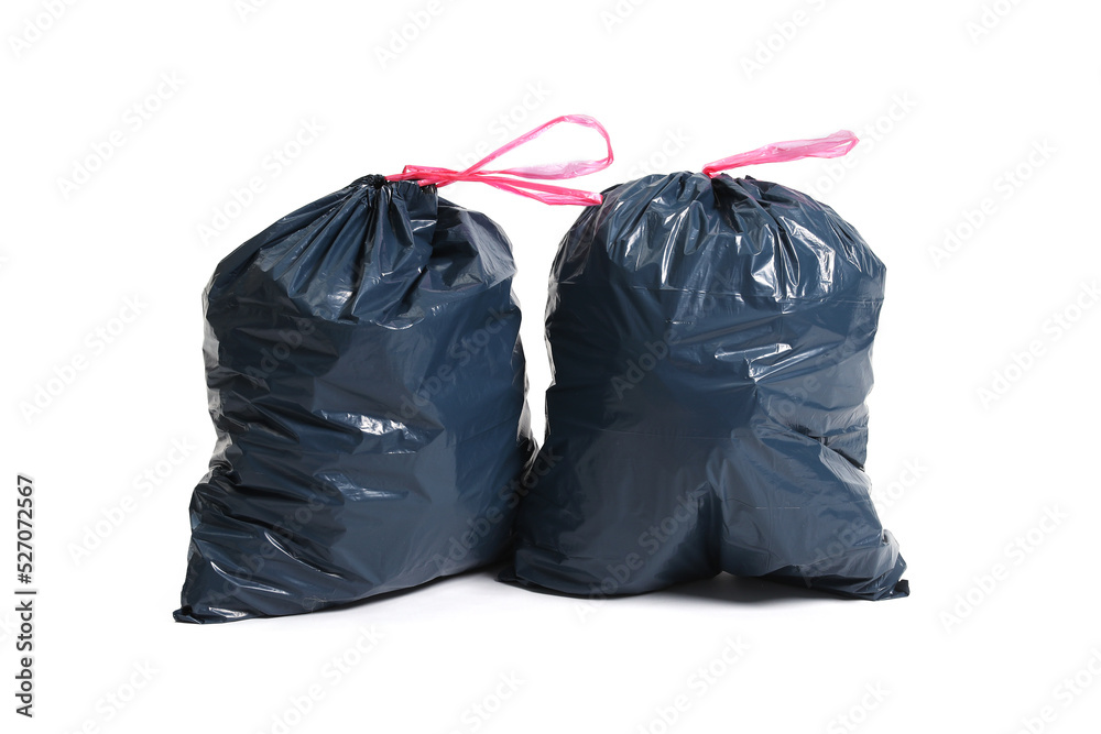 Two big black plastic bags for trash waste placed on a white background