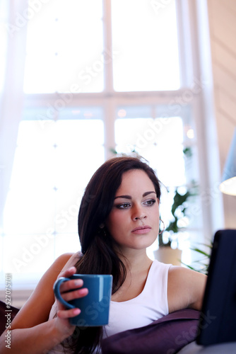 Free Download Portrait of a gorgeous young brunette relaxing with cup of hot beverage. - GFXLoad