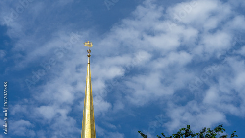 Ship on the spire of the Admiralty building against the sky with clouds, St. Petersburg, Russia. Copy space for text. photo