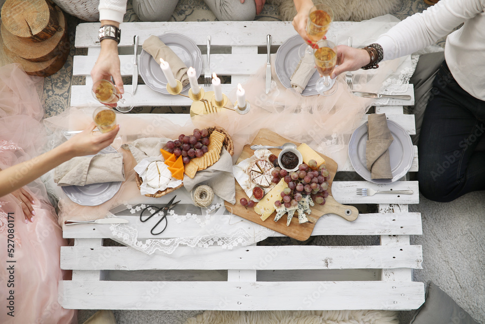 Top view of festive table with snacks and candles at the party