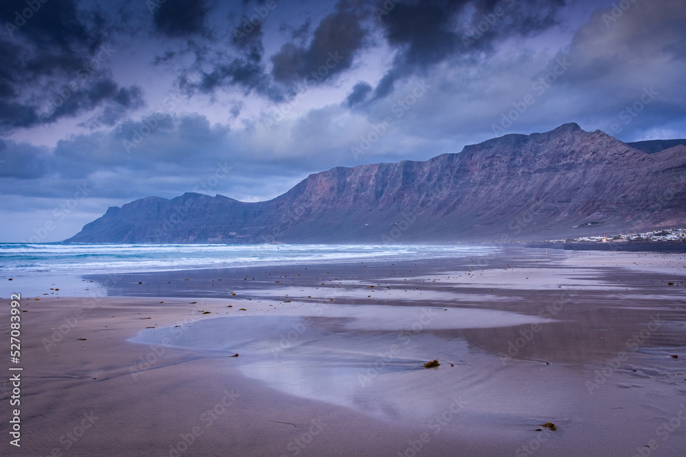 The amazing Famara beach on the Atlantic Ocean in Lanzarote, Canary Islands,  Spain