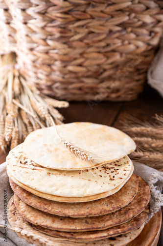 Spianata Sarda. Typical tortilla bread in italy Sardinia region. Baking bread Thin round with different flour. Vertical photo