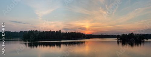 sunset over a forest lake